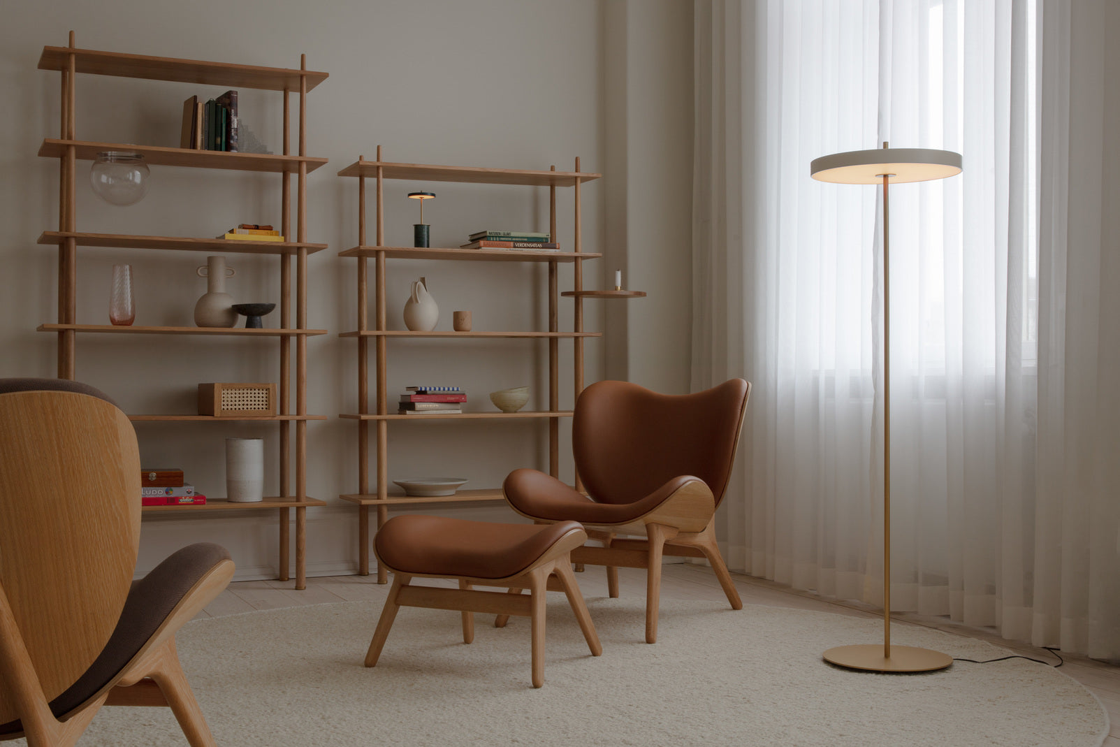 Living room in soft daylight with sofa and table lamp