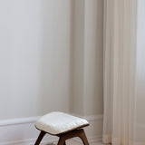 UMAGE_lifestyle_The Reader_ottoman_dark oak_teddy white_(3).jpeg