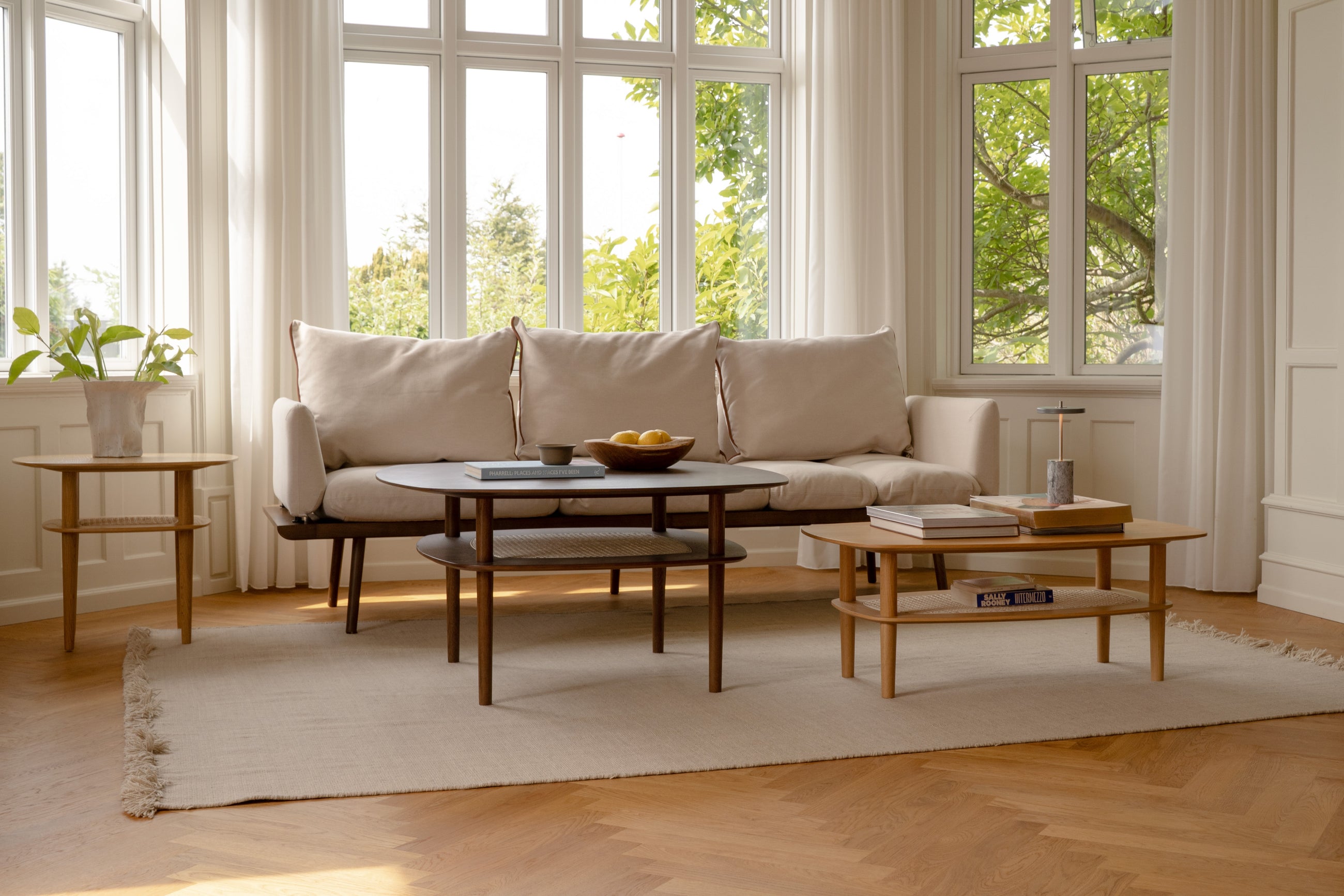 Living room in soft daylight with sofa and table lamp